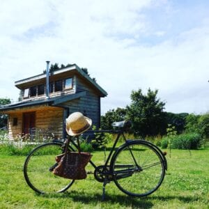 Tiny Homes Holidays - Eco-friendly lodges for off-grid vacations on the Isle of Wight, set in a natural meadow, adjacent to ancient woodland