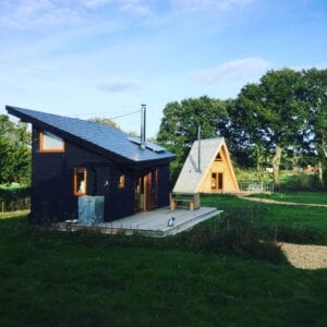 Tiny Homes Holidays - Eco-friendly lodges for off-grid vacations on the Isle of Wight, set in a natural meadow, adjacent to ancient woodland