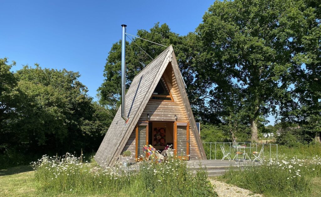 Tiny Homes Holidays - Eco-friendly lodges for off-grid vacations on the Isle of Wight, set in a natural meadow, adjacent to ancient woodland