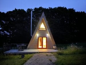 Tiny Homes Holidays - Eco-friendly lodges for off-grid vacations on the Isle of Wight, set in a natural meadow, adjacent to ancient woodland
