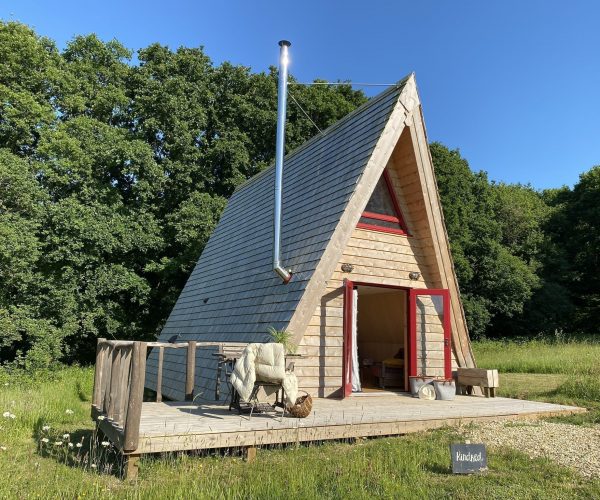 Tiny Homes Holidays - Eco-friendly lodges for off-grid vacations on the Isle of Wight, set in a natural meadow, adjacent to ancient woodland
